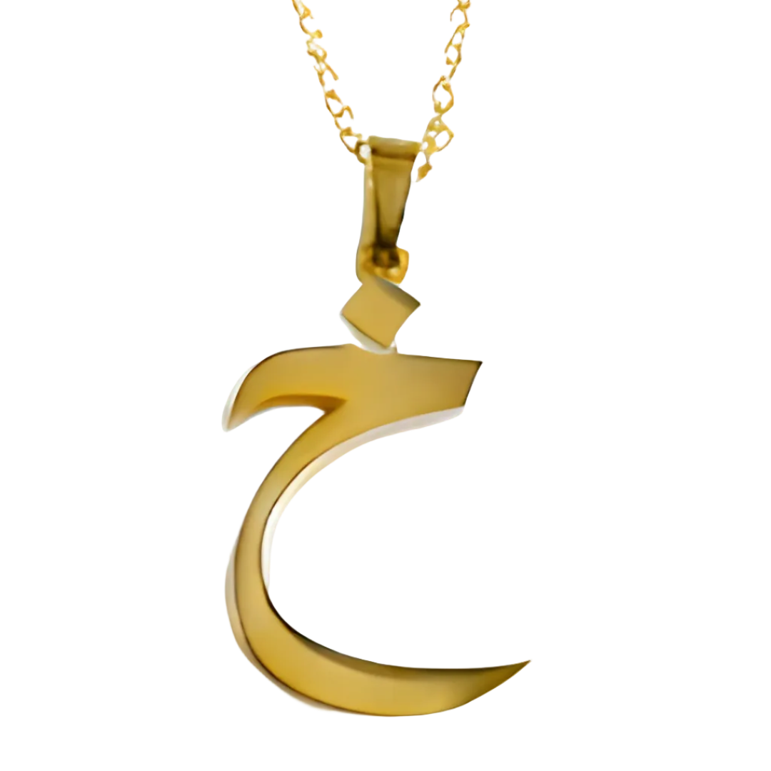 Gold crescent moon pendant on a white background