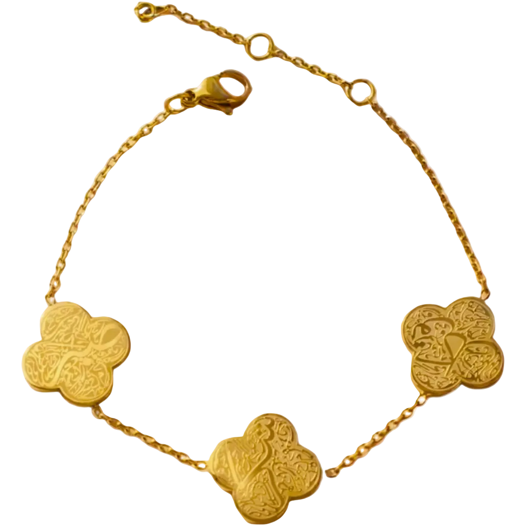 Gold bracelet with clover-shaped charms on a white background