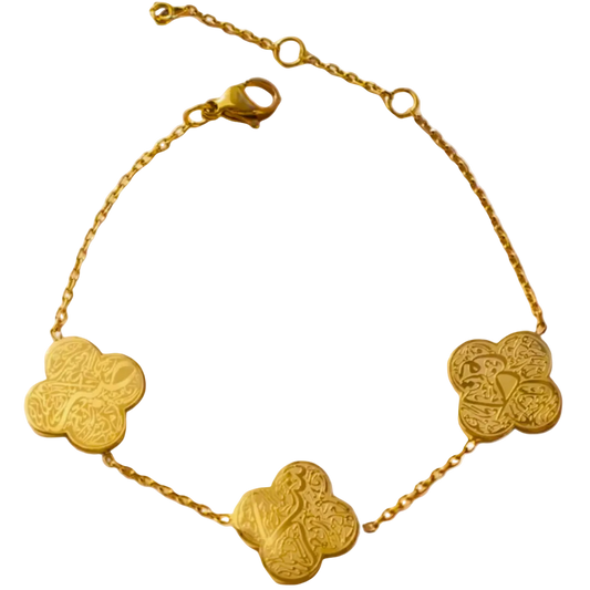 Gold bracelet with clover-shaped charms on a white background